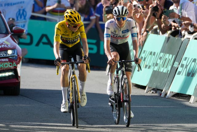 Jonas Vingegaard and Tadej Pogacar crossed the line together at the end of stage 15 of the Tour de France (Thibault Camus/AP)
