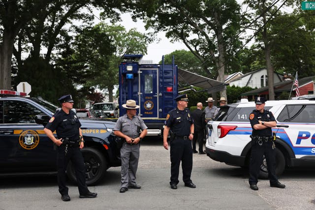 <p>Law enforcement officials are seen as they investigate the home of a suspect arrested in the unsolved Gilgo Beach killings on July 14, 2023 in Massapequa Park, New York. </p>