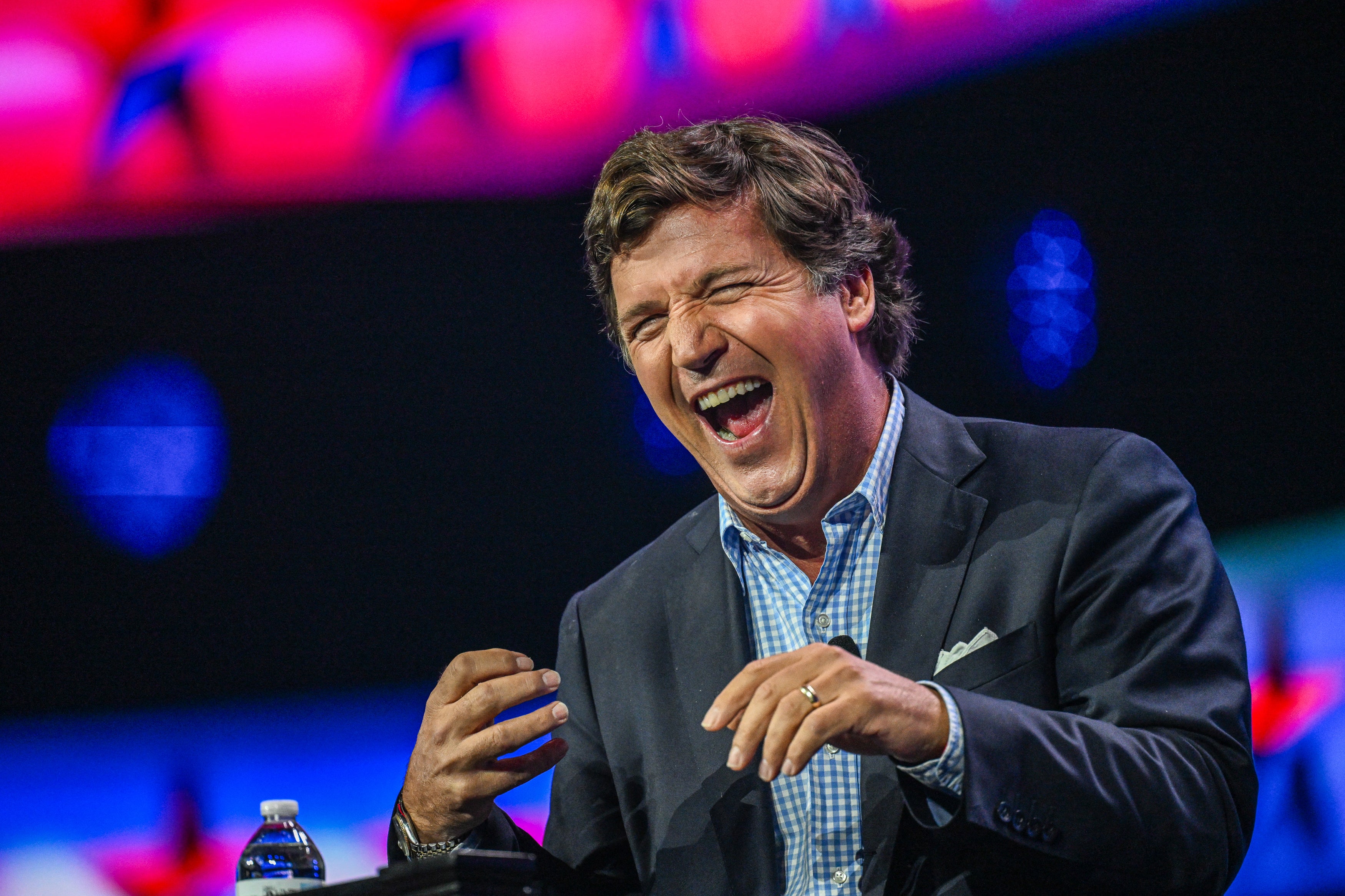 Tucker Carlson addresses the Turning Point Action Conference in Florida on 15 July.