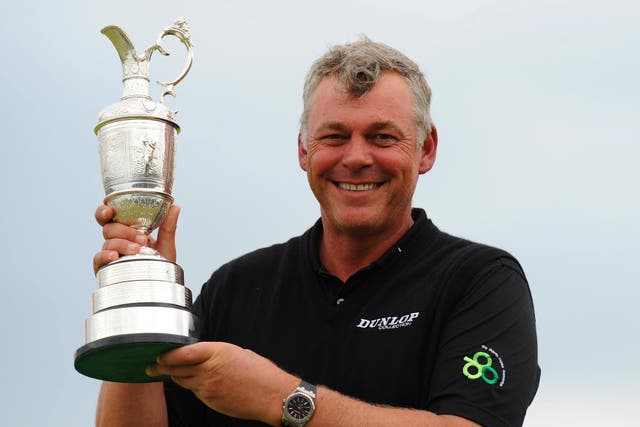 Darren Clarke holds the Claret Jug after winning the 2011 Open Championship at Royal St George’s (Owen Humphreys/PA)