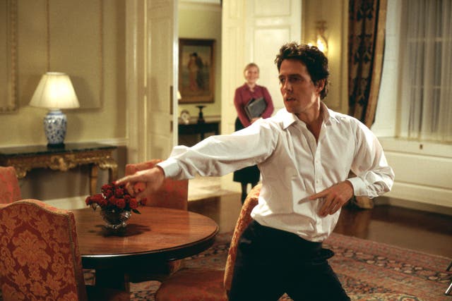 <p>Hugh Grant dances as a fictional PM in ‘Love Actually’</p>