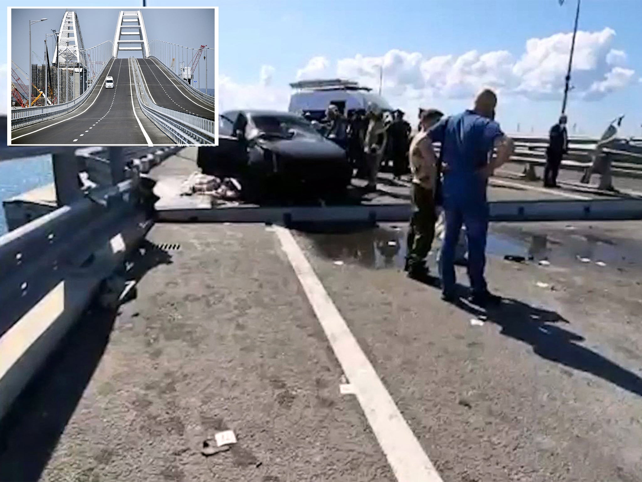 Russian officials on the Kerch Bridge yesterday