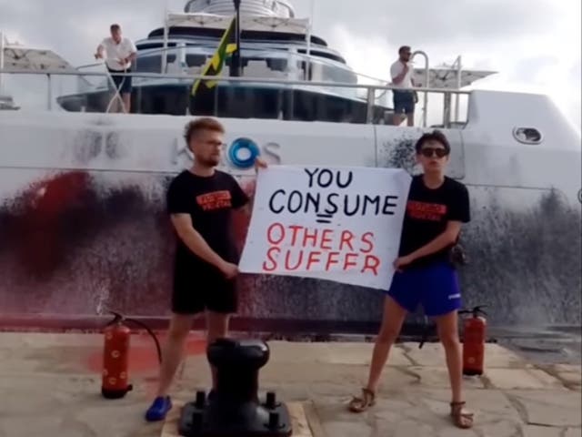 <p>Activists from environmental group Futuro Vegetal sprayed paint on a superyacht owned by Walmart heiress Nancy Walton Laurie which was docked in Ibiza on Sunday 16 July 2023</p>