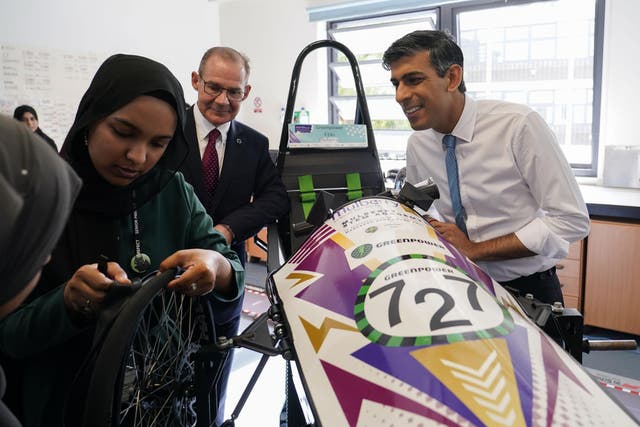 Prime Minister Rishi Sunak (right) looks at a car prototype during a visit to Mulberry School for Girls in east London (Alberto Pezzali/PA)