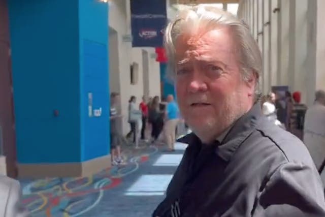 <p>Steve Bannon is confronted about his ‘Build the Wall Fund’ fraud trial during the Turning Point Action conference in Florida </p>
