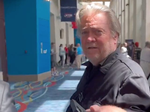 <p>Steve Bannon is confronted about his ‘Build the Wall Fund’ fraud trial during the Turning Point Action conference in Florida </p>