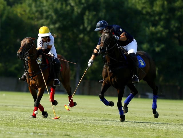 <p>Polo enthusiasts battle for the ball at Tianjin season opening tournament in June, 2023</p>
