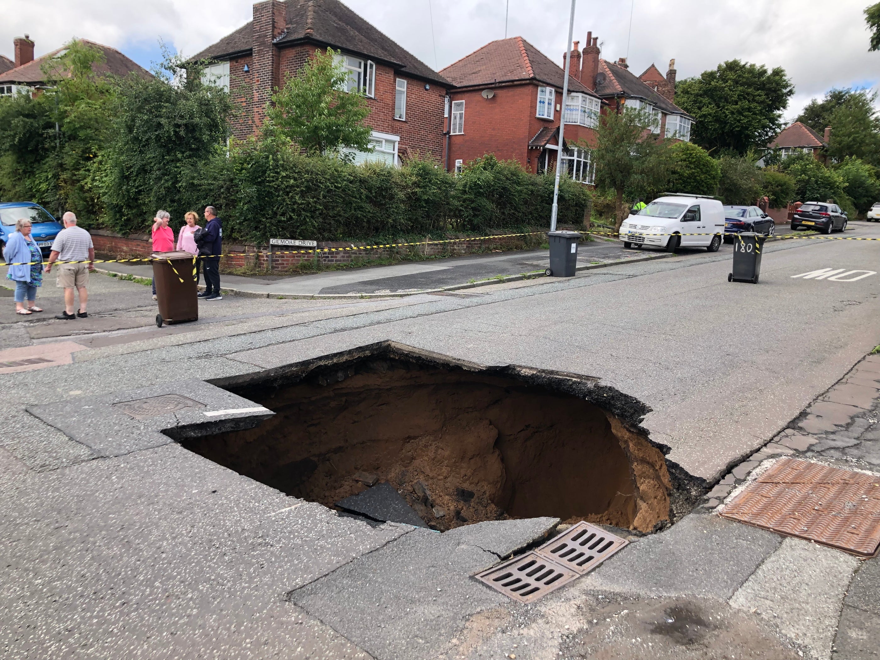 A huge sinkhole suddenly appeared in the middle of a busy road, leaving homeowners fuming