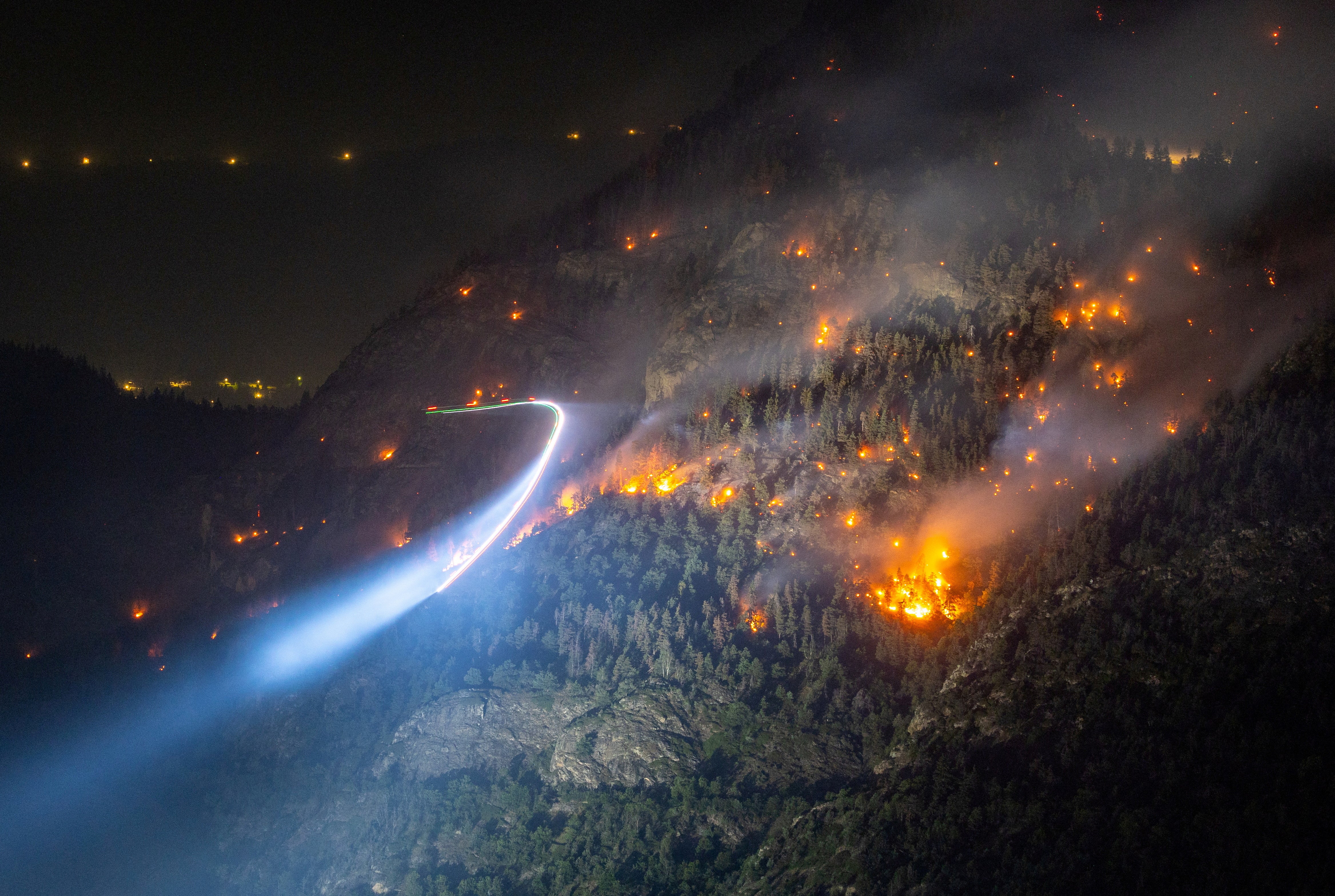 General view of a wildfire on the flank of a mountain in Bitsch near Brig, Switzerland, 18 July 2023