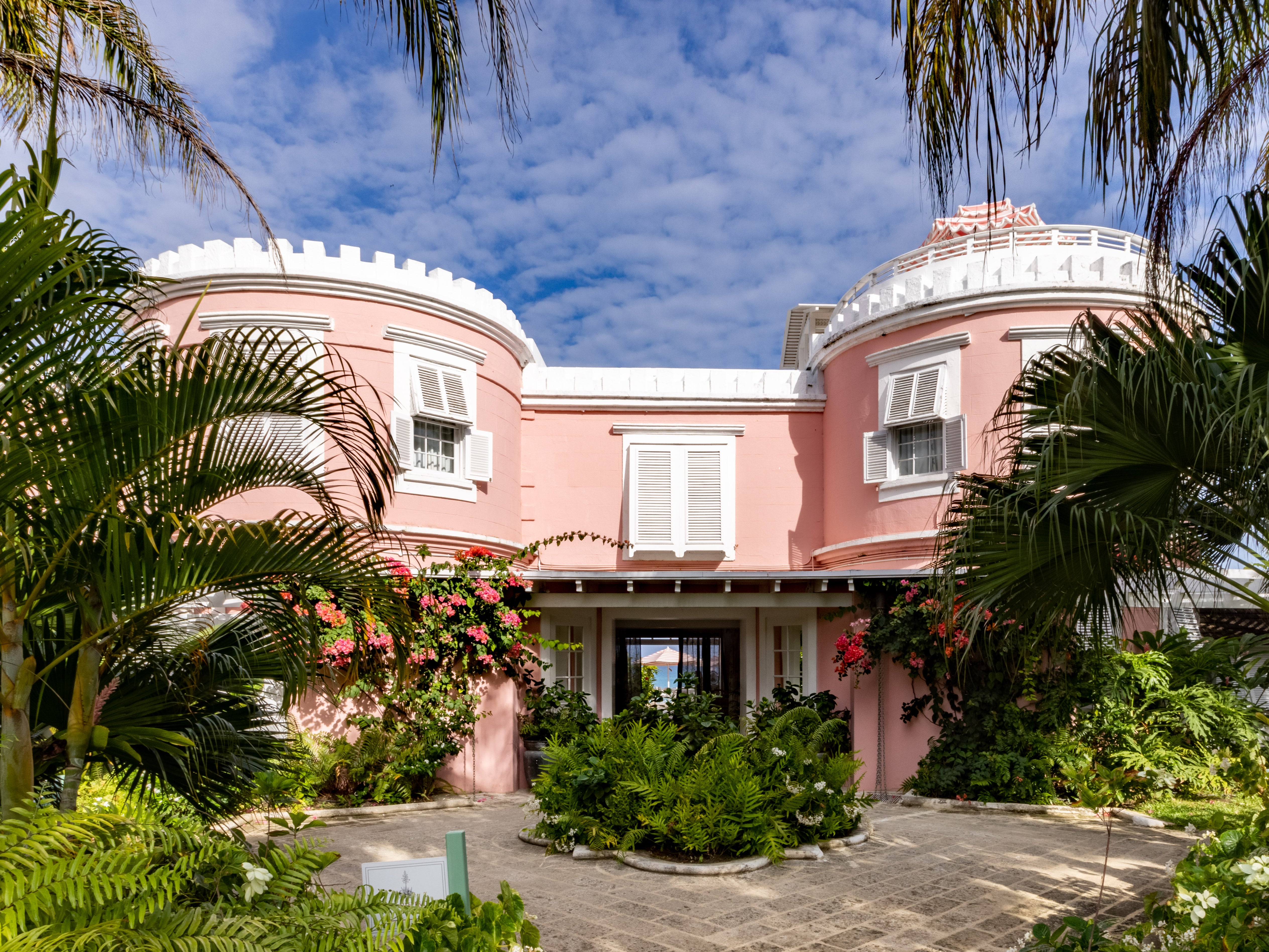 Think candy-striped parasols and rose-hued walls at Cobblers Cove, Barbados
