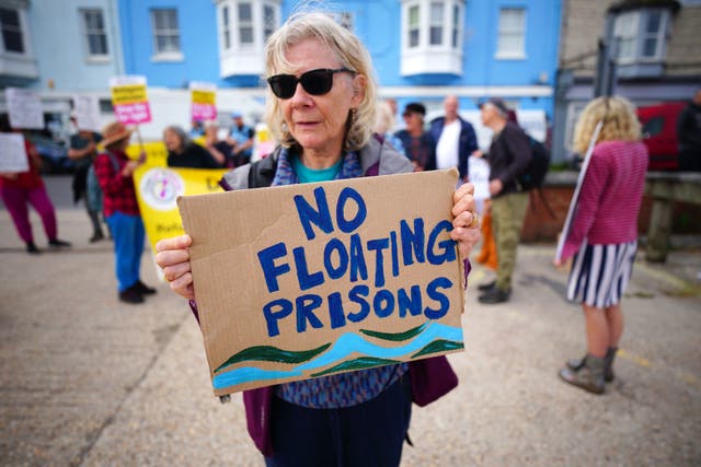 <p>A protester in Portland in Dorset </p>