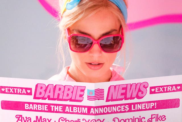 <p>Margot Robbie’s Barbie surveys the track listing of her soundtrack album </p>