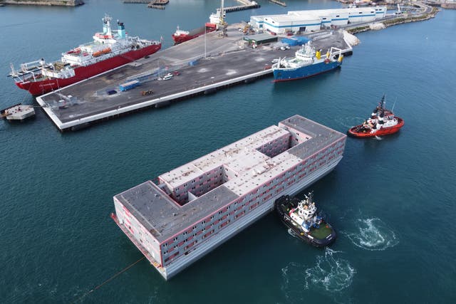 <p>A ‘performative’ gesture: the Bibby Stockholm accommodation barge arrives in Portland </p>