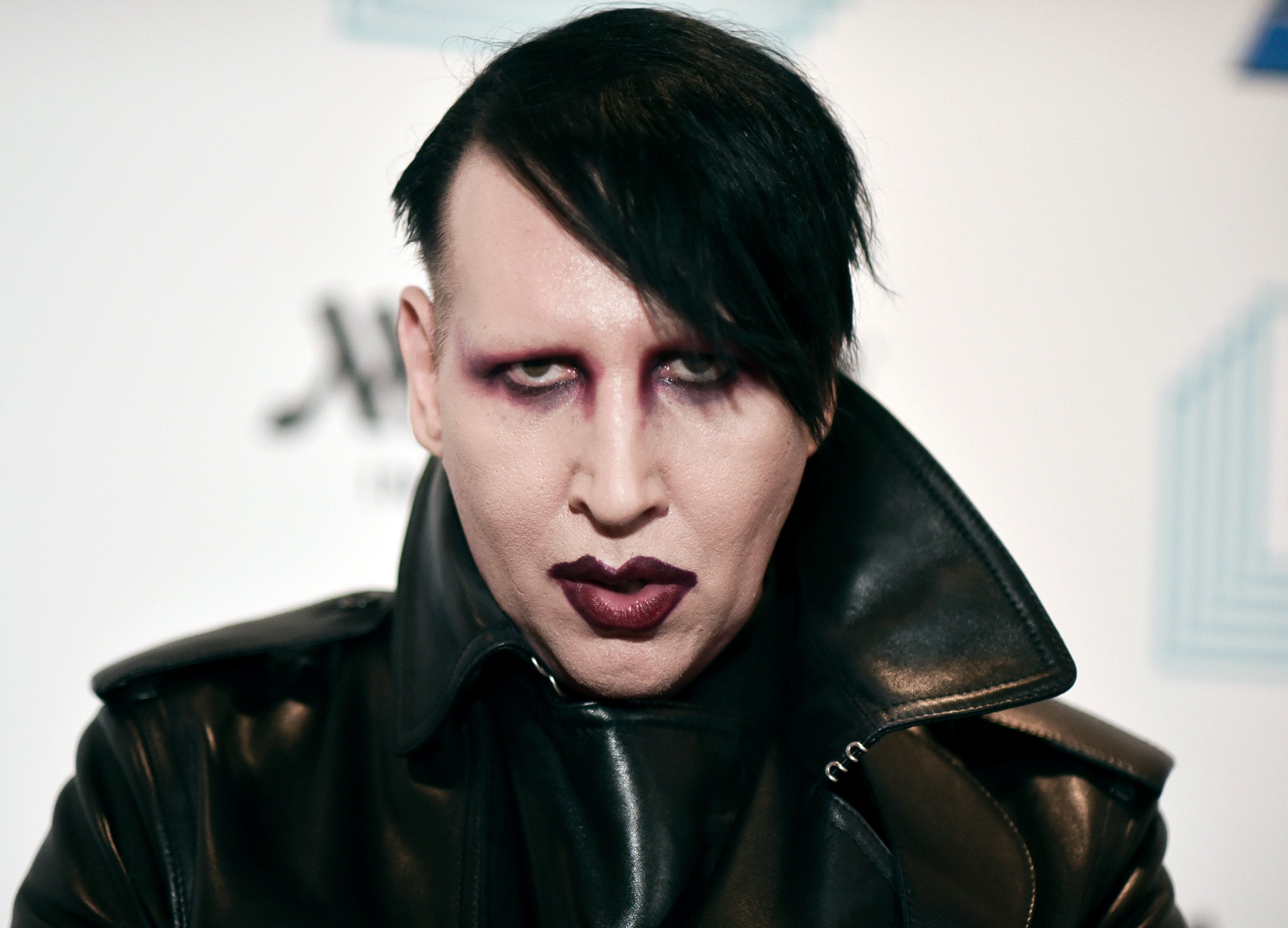 Marilyn Manson fined for blowing nose on concert camerawoman - BBC News