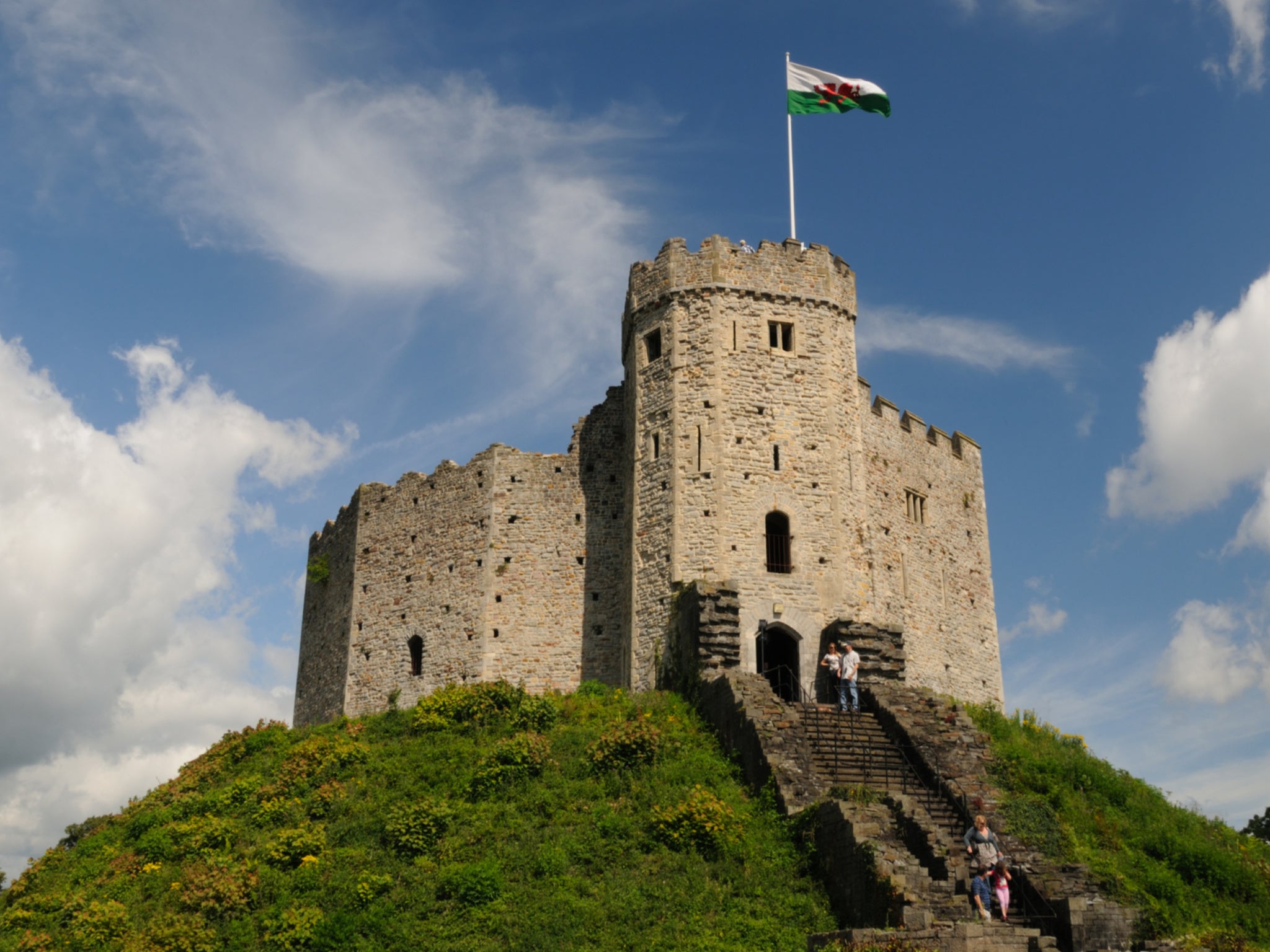 A Welsh flag atop the 11th-century Norman keep at Cardiff Castle