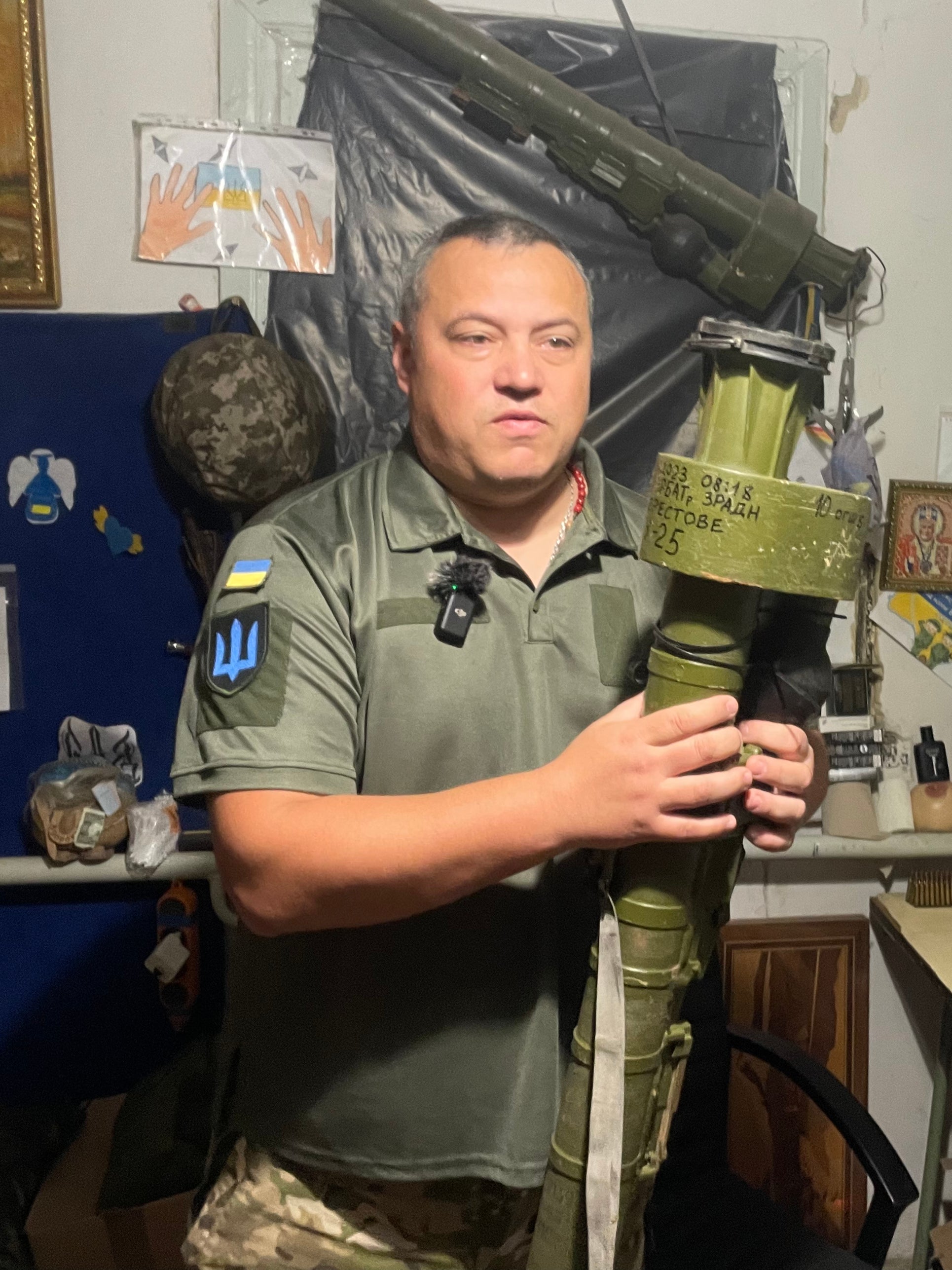 The commander, Kamin, in the air defence units base on the Bakhmut front line. He is carrying a handheld missile launcher