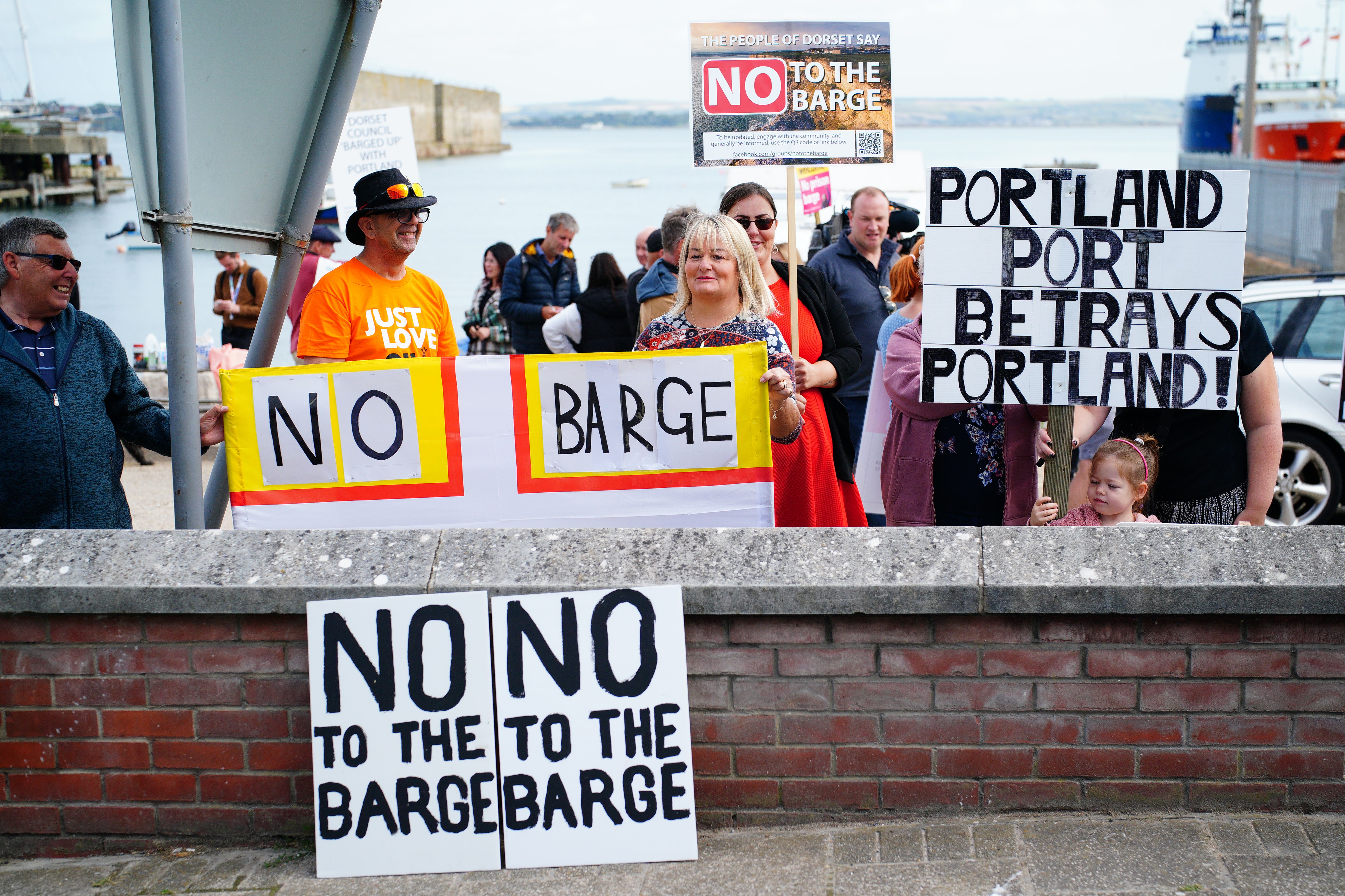Protesters in Portland in Dorset after the barge arrived