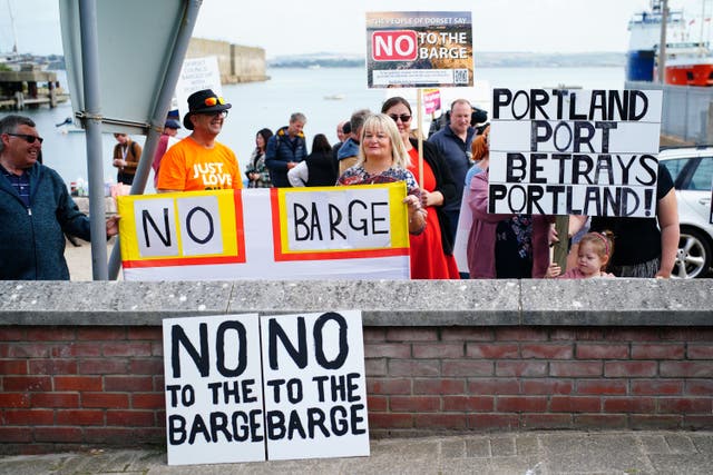 Protesters in Portland in Dorset after the Bibby Stockholm accommodation barge arrived (Ben Birchall/PA)