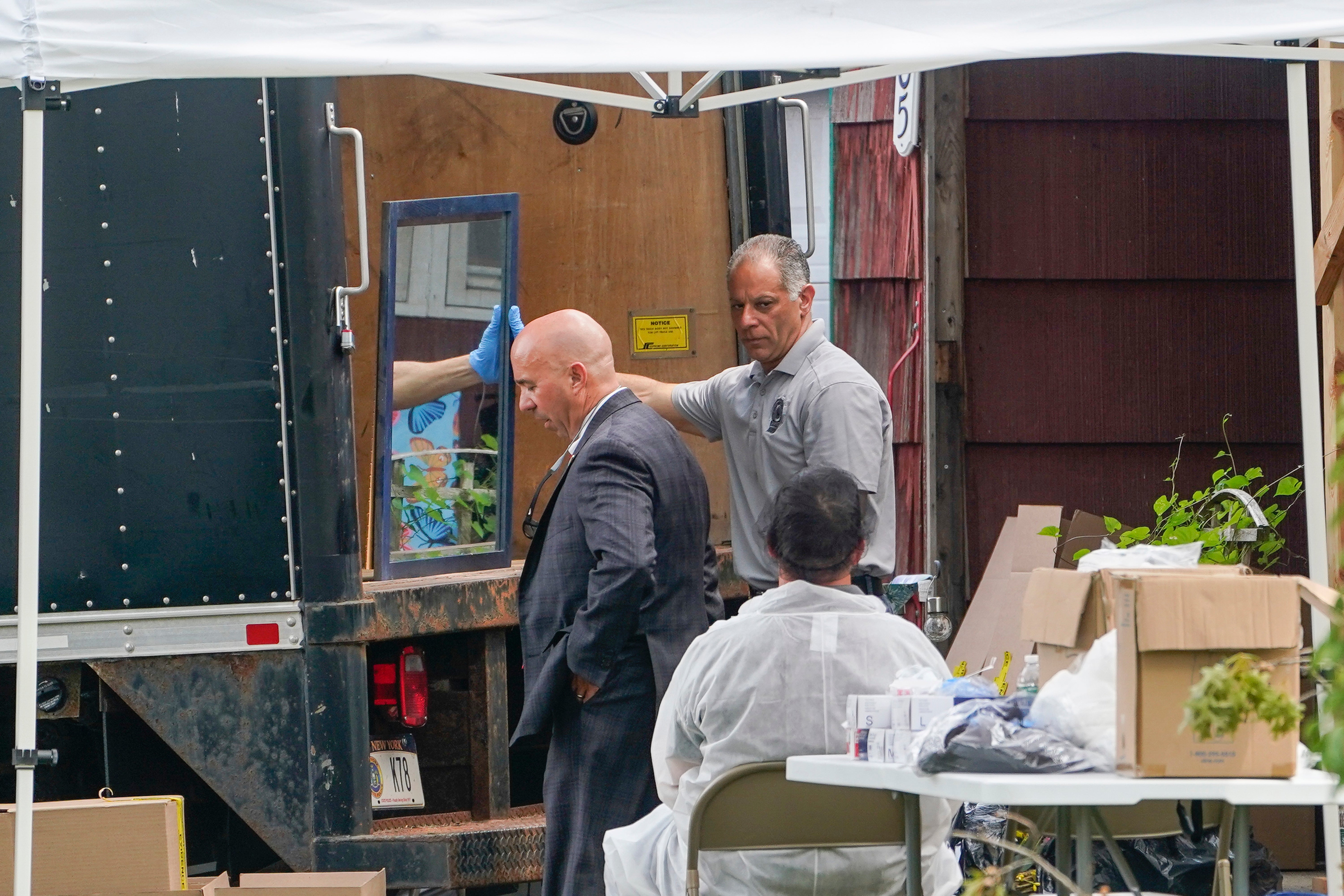 Authorities search the home of suspect Rex Heuermann, Tuesday, July 18, 2023, in Massapequa Park, N.Y