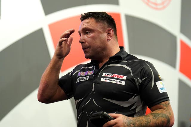 Gerwyn Price, pictured, joined Michael Van Gerwen in making an early exit in Blackpool (Zac Goodwin/PA)