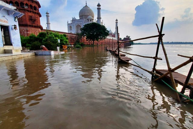 <p>This photograph taken on 17 July 2023 shows flooded banks of river Yamuna along the Taj Mahal in Agra. Flooding and landslides are common and cause widespread devastation during India’s treacherous monsoon season, but experts say climate change is increasing their frequency and severity</p>