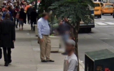 Google street view image appears to show Rex Heuermann chatting to a woman near his office