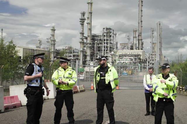 Police and security outside the Ineos plant at Grangemouth (Climate Camp Scotland/PA)