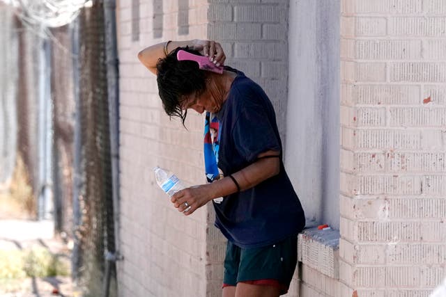 <p>A person tries to cool off in the shade as temperatures are expected to hit 116-degrees Fahrenheit, Tuesday, July 18, 2023, in Phoenix. </p>