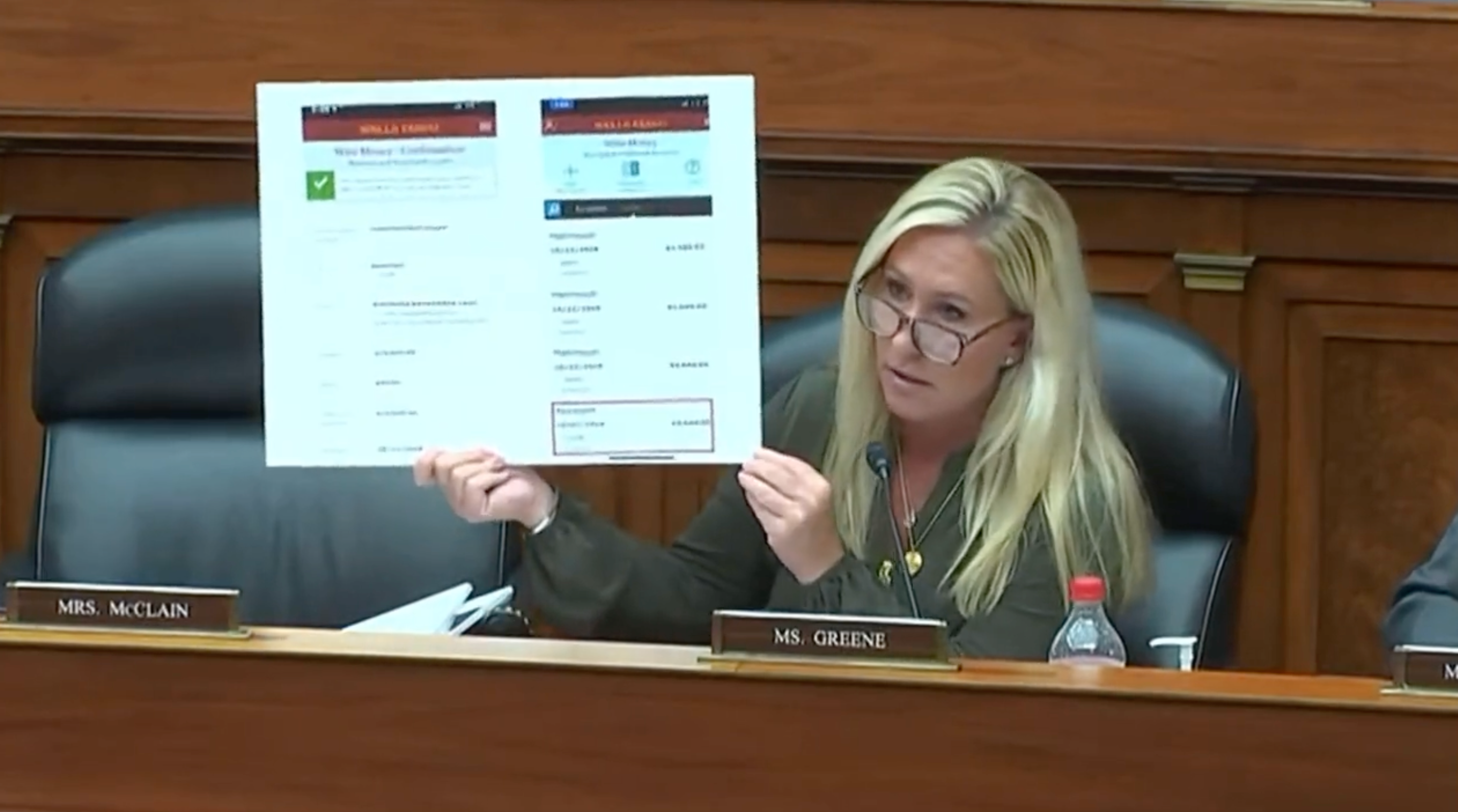 Marjorie Taylor Greene holds up picture boards related to Hunter Biden, some of which include naked photos