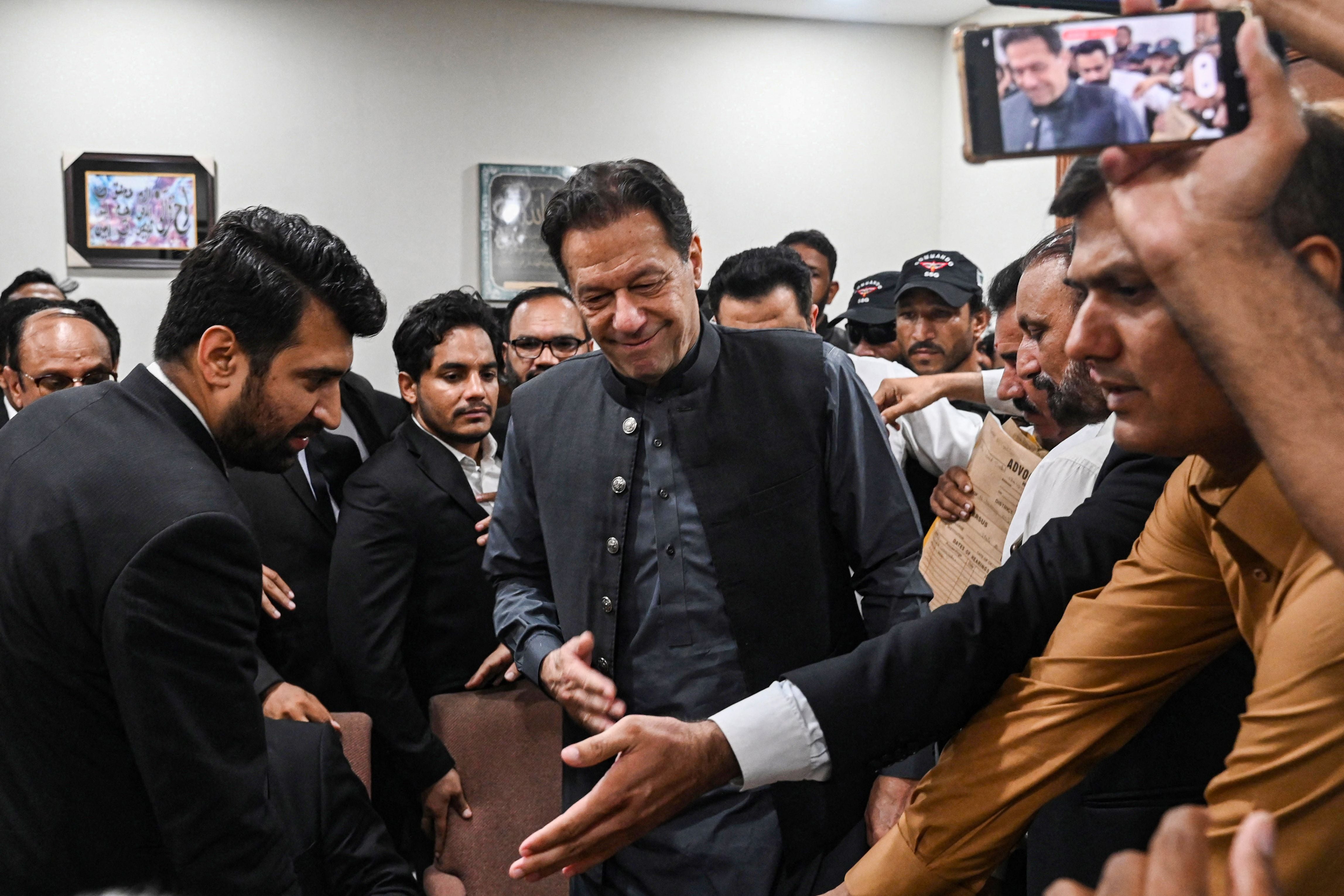 <p>Pakistan’s former prime minister, Imran Khan arrives at a registrar office in Lahore High court to sign surety bonds for bail in various cases, in Lahore on 3 July</p>