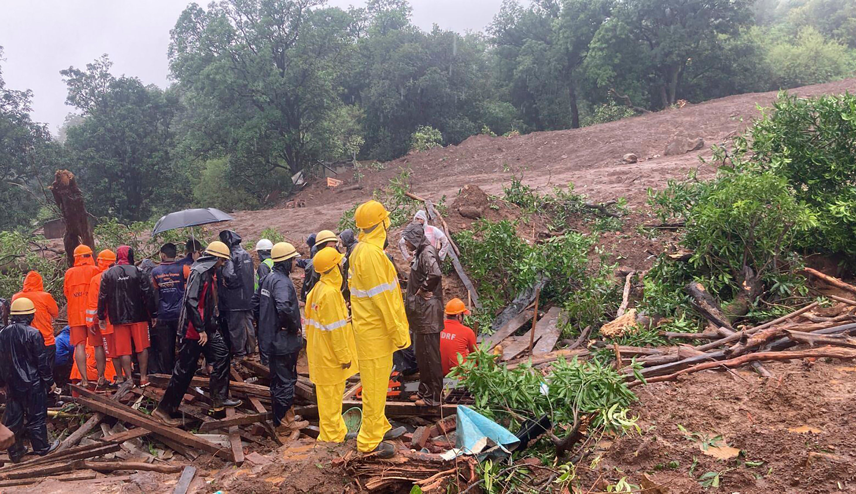 <p>Rescuers work at a site of a landslide in Raigad district, in India’s western Maharashtra state</p>