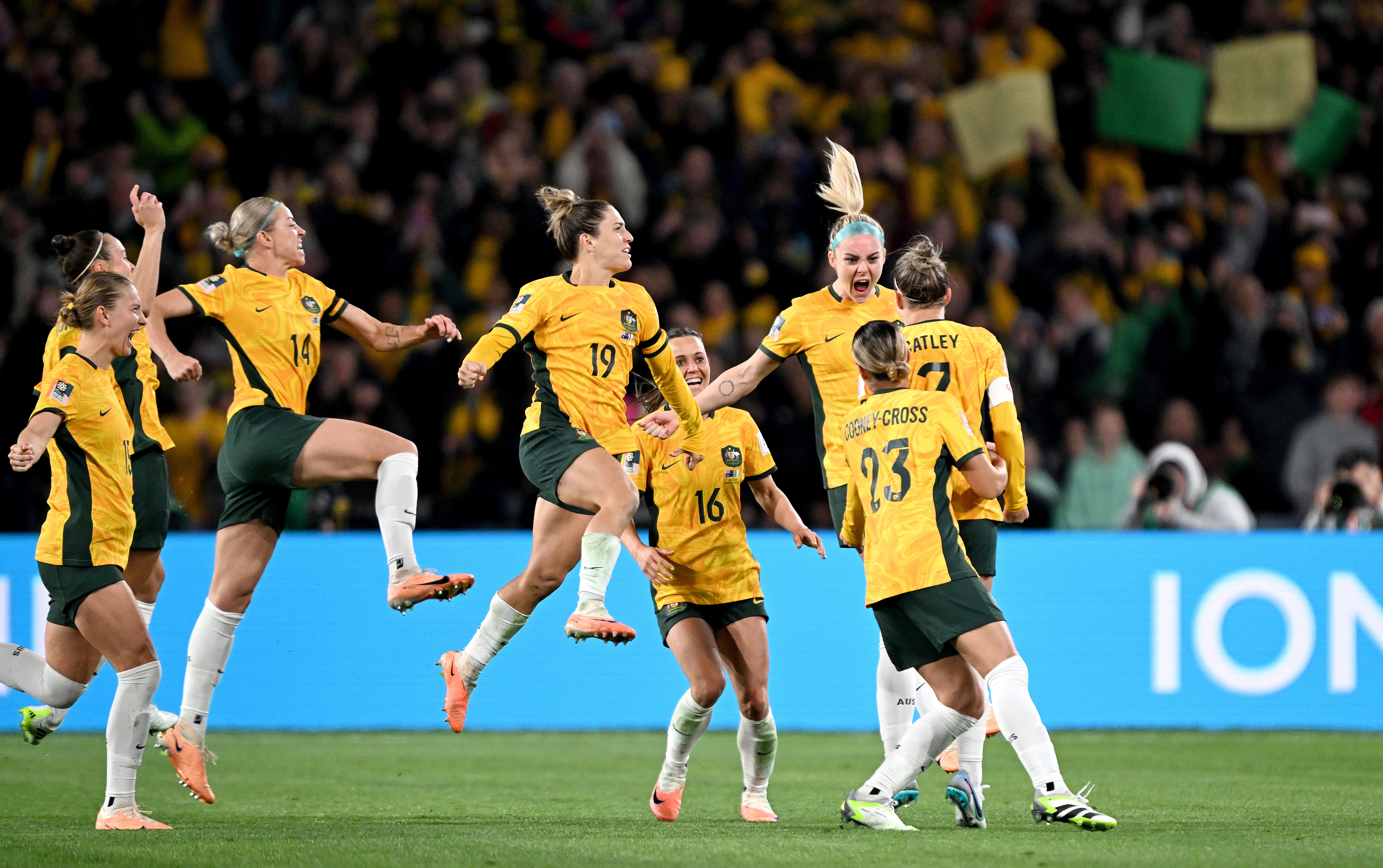 Steph Catley of the Matildas is congratulated by team mates after scoring