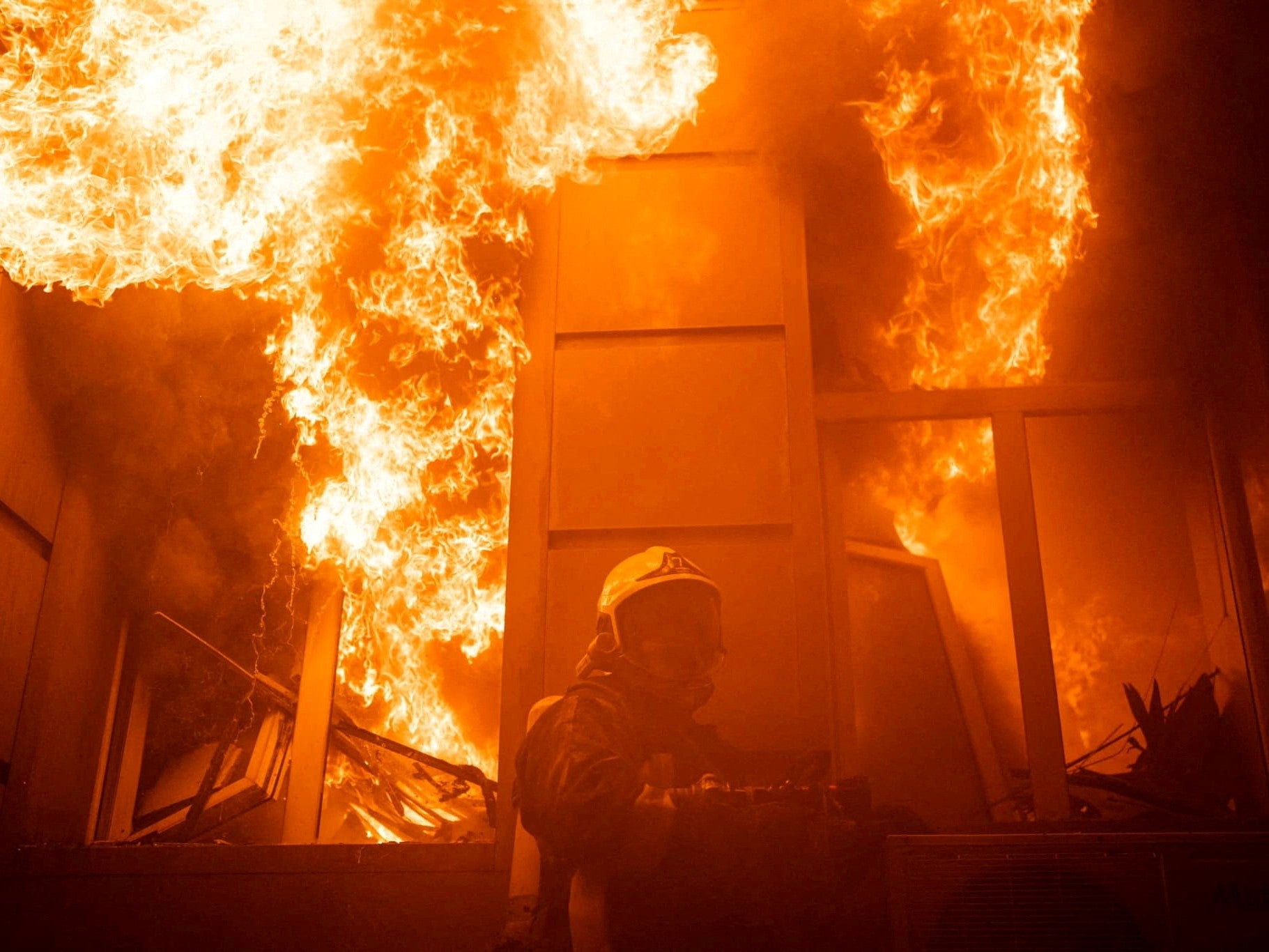 A firefighter in a building heavily damaged by Thursday’s Russian missile strike in Odesa