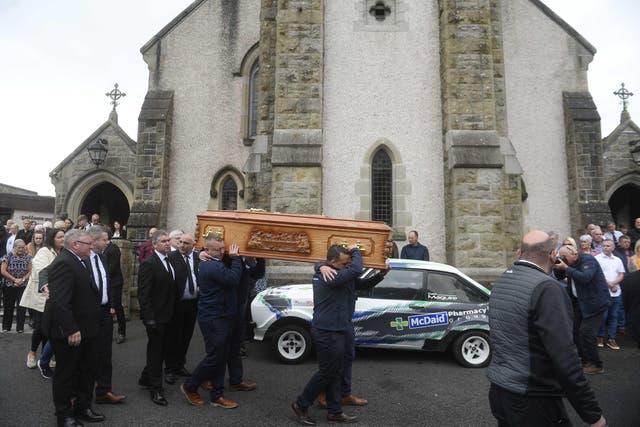 The coffin of Daire Maguire is carried from the church (Mark Marlow/PA)