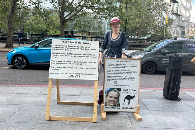 Lady Dorit Page demonstrating outside UCLH (PA)