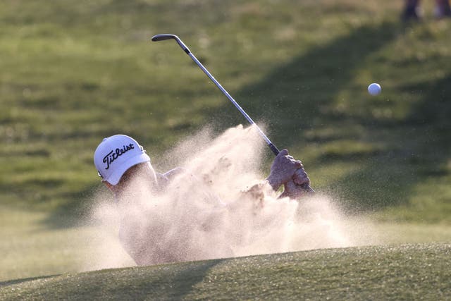 Justin Thomas chips out of a bunker on the 18th during day one of The Open at Royal Liverpool (Richard Sellers/PA)