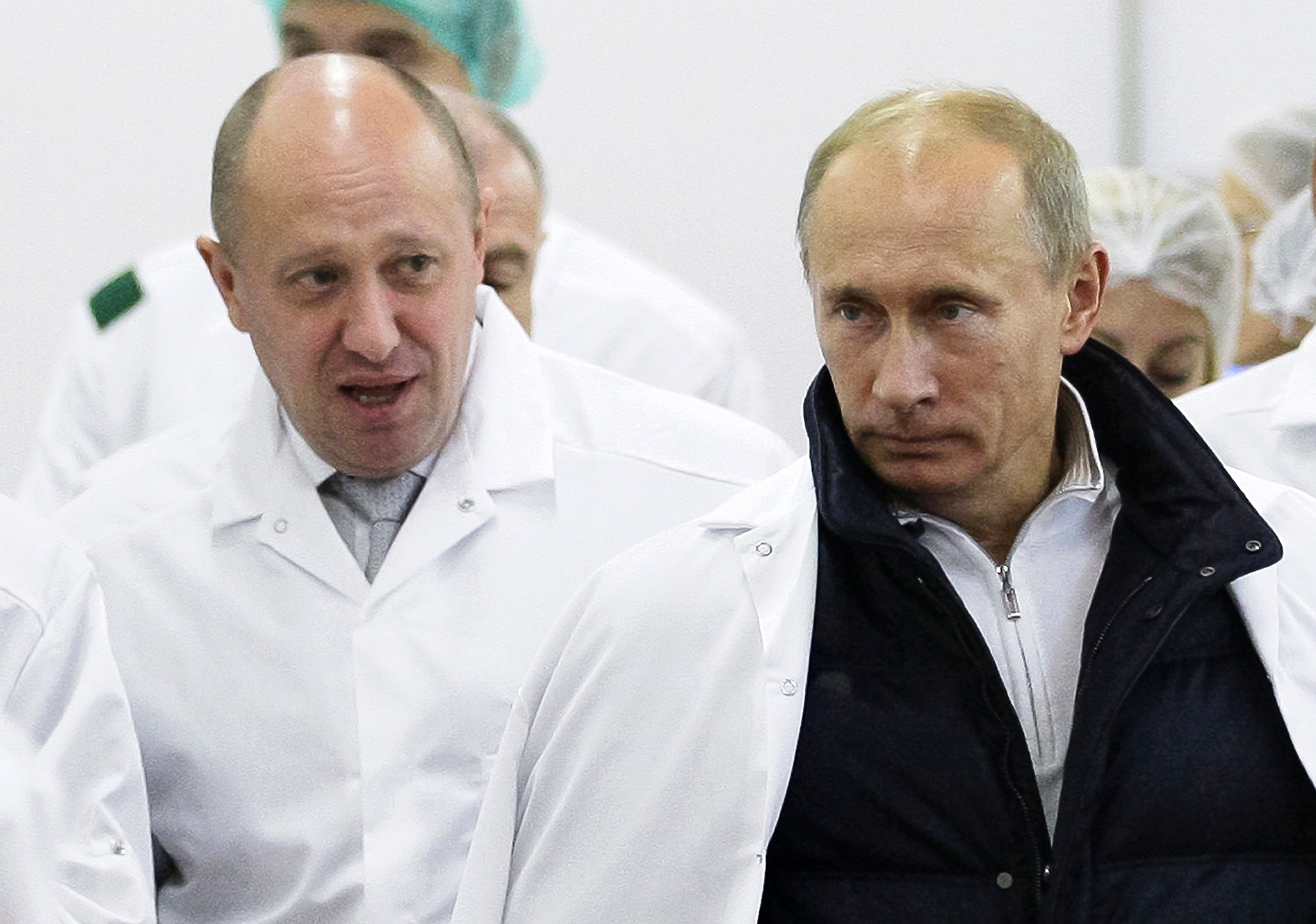 Then-businessman Yevgeny Prigozhin, left, shows Russian president Vladimir Putin around his factory in Sept 2010