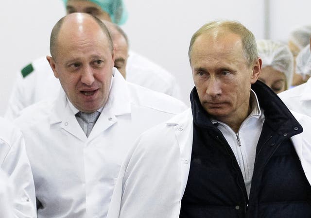 <p>Yevgeny Prigozhin, left, shows Russian president Vladimir Putin around his factory in September 2010</p>