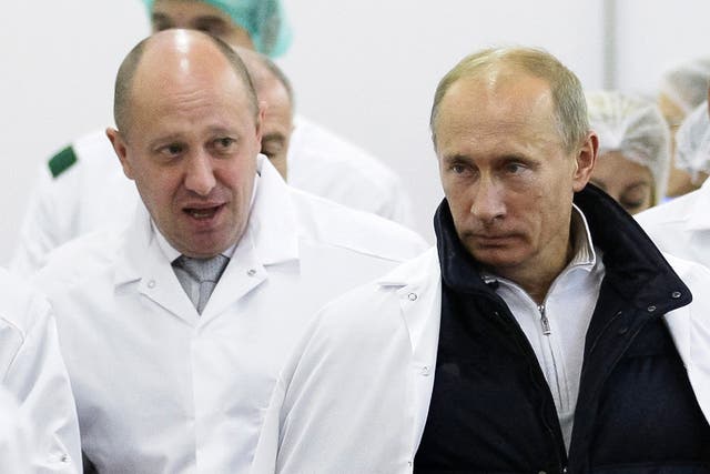 <p>Yevgeny Prigozhin, left, shows Russian president Vladimir Putin around his factory in September 2010</p>