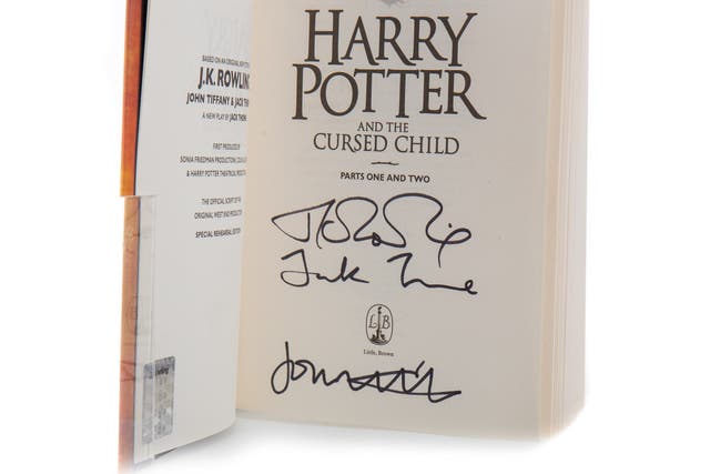 A signed copy of JK Rowling’s Harry Potter And The Cursed Child has been sold to a collector for £970 at a Glasgow auction (McTear’s/PA)
