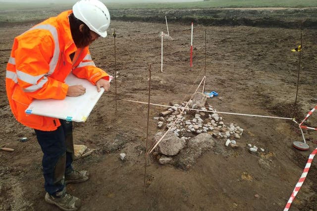 A worker at the Shetland spaceport examines remains found at the site (Shetland Spaceport/PA)