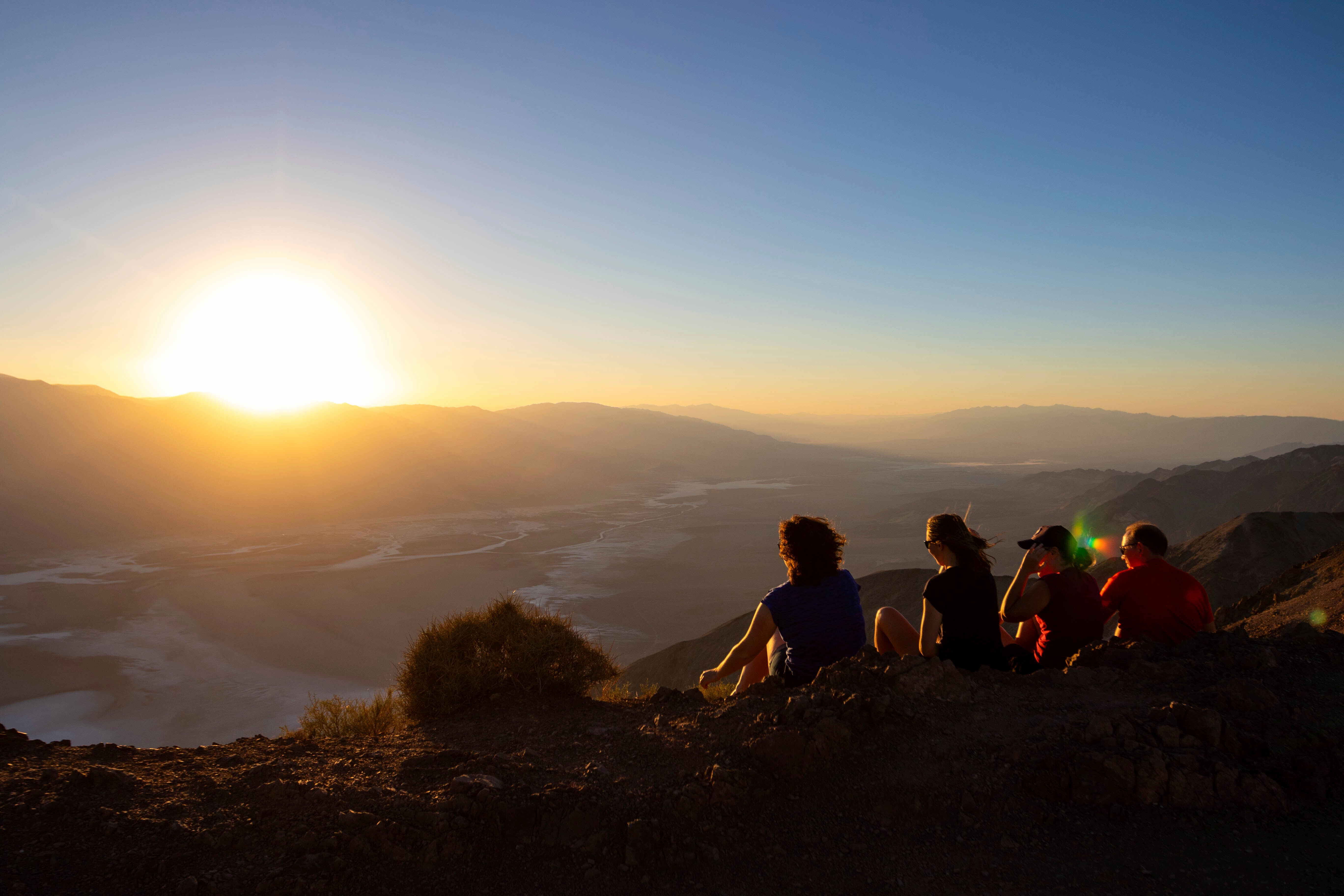 Park visitors watch the sunset on Tuesday 11 July 2023 in Death Valley National Park