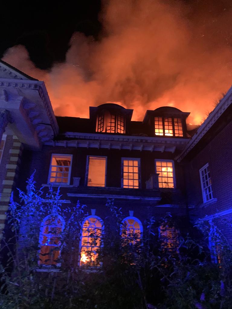The roof of the three-storey mansion was completely destroyed in the blaze