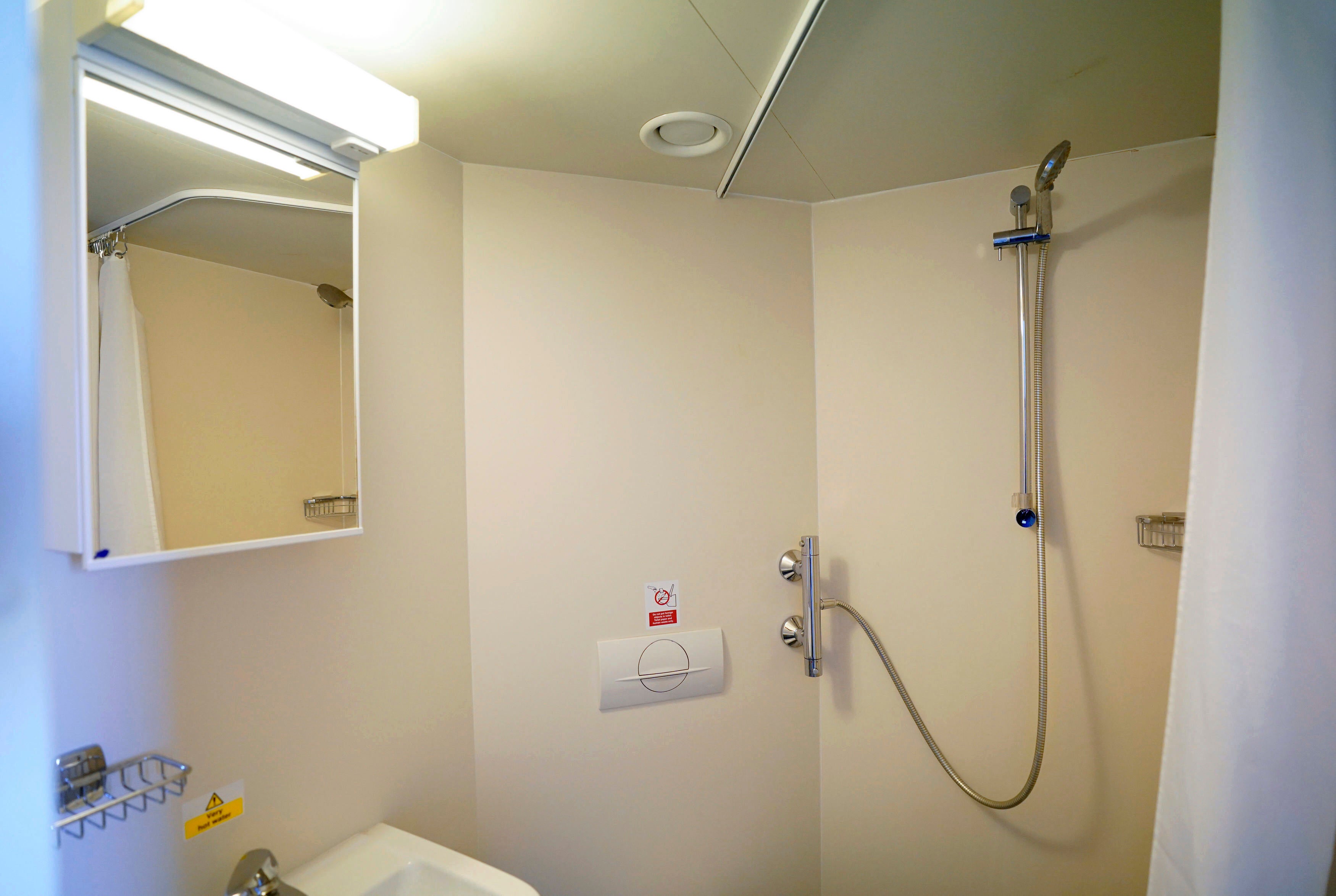 A view of the en-suite bathroom in one of the Bibby Stockholm’s 222 cabins