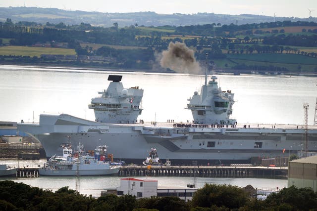 Aircraft carrier HMS Prince of Wales leaves Rosyth docks following repairs (Andrew Milligan/PA)