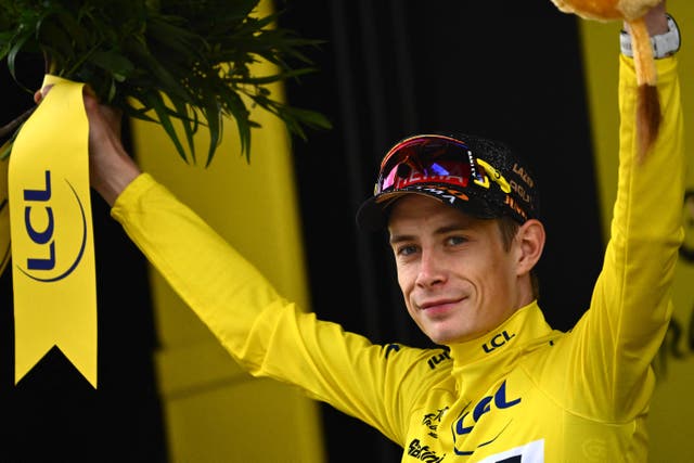 <p>Jonas Vingegaard celebrates wearing the yellow jersey</p>