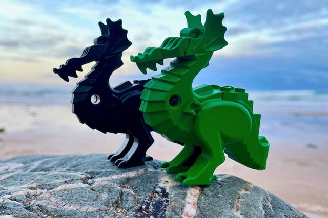 <p>A black dragon and a rare green one, missing their arms, wings and tails</p>