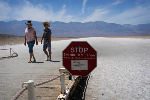 <p>A sign warns hikers of the dangers of heading out in Death Valley National Park </p>