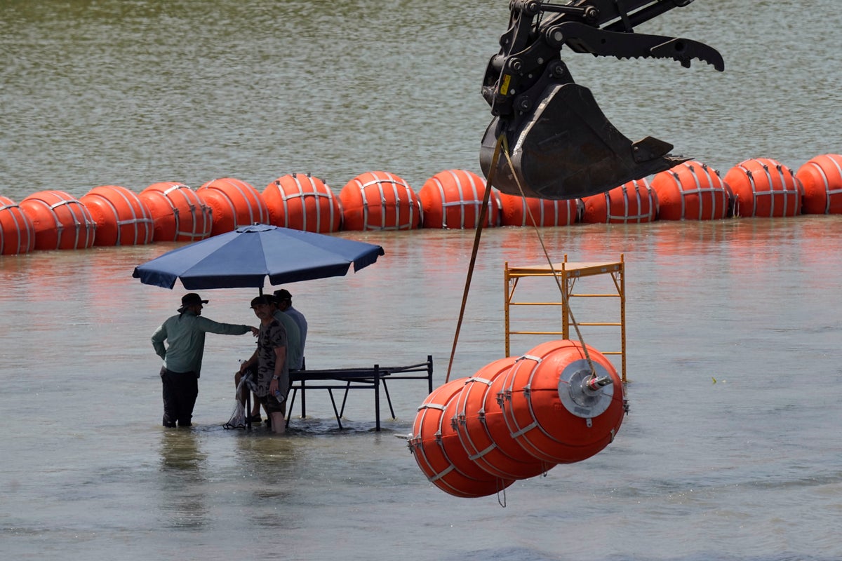 Justice Department tells Texas that floating barrier on Rio Grande raises humanitarian concerns