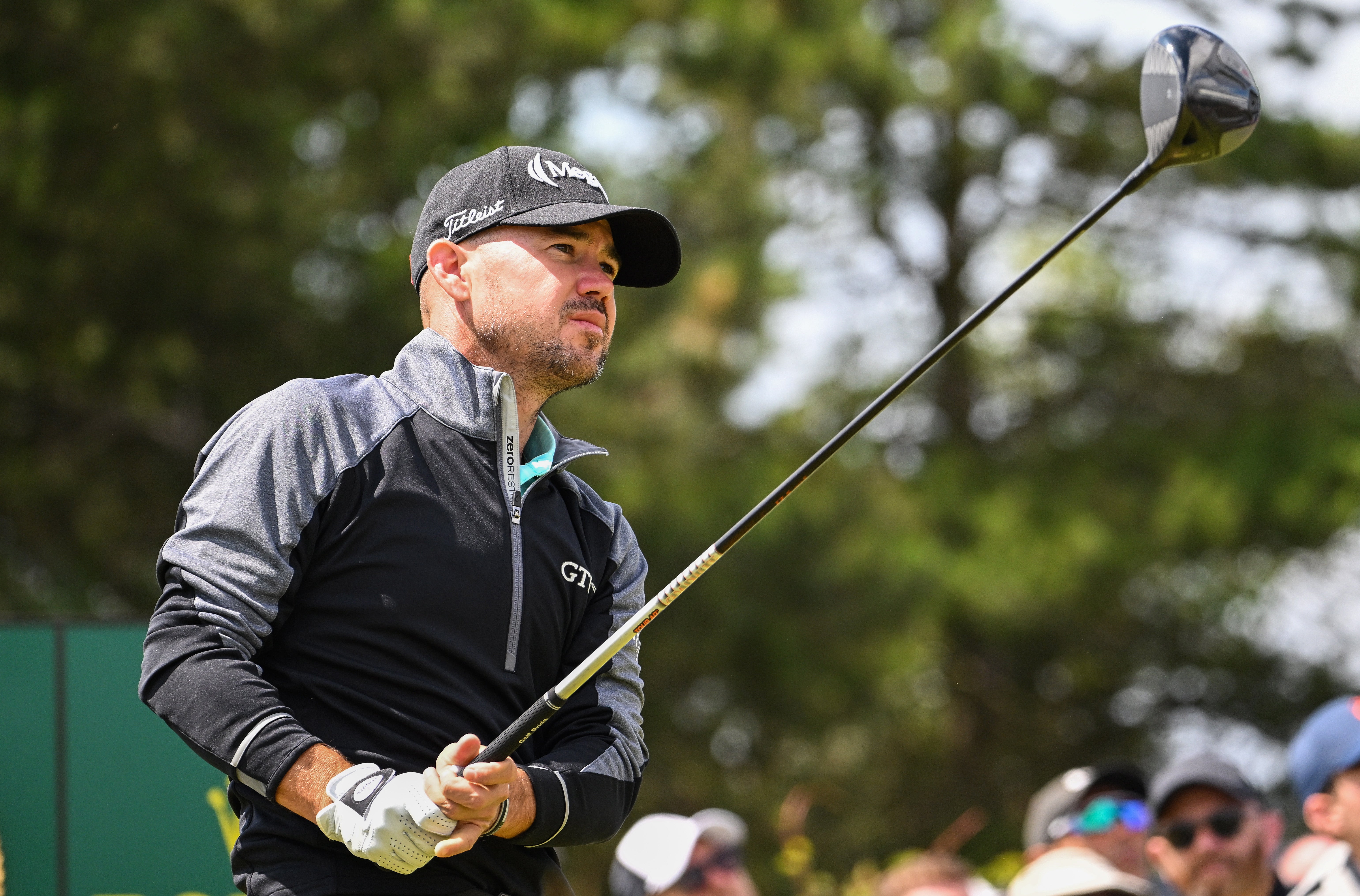 Brian Harman plays the 18th hole on Friday